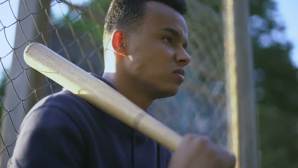 Teenage Boy Holding Baseball Bat, Youth Gang in Ghetto, Juvenile Delinquency