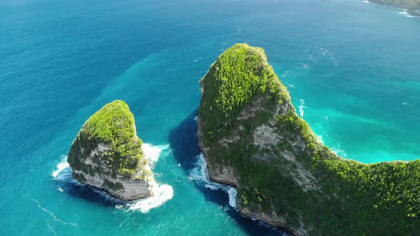 Aerial View of Big Blue Sea Wave Viewpoint.  Beautifulbeach of Kelingking in Nusa Penid. Drone Shot