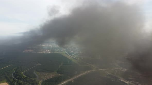 Aerial view black smoke pollution due to fire burning