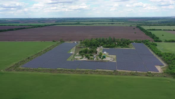 Aerial View on a Massive Solar Power Station in the Field Renewable Energy