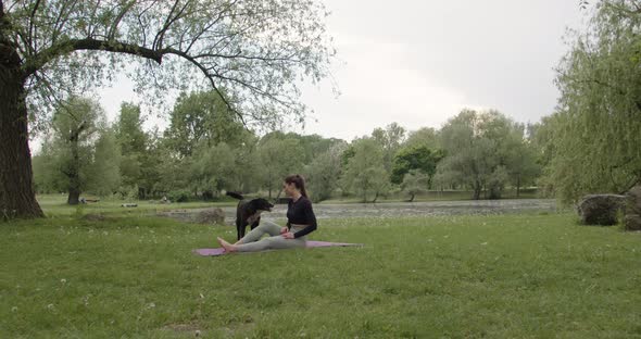 Portrait of a Young Woman Practicing Yoga in the Garden