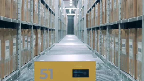 Robotic Machine is Riding Through the Warehouse By Itself