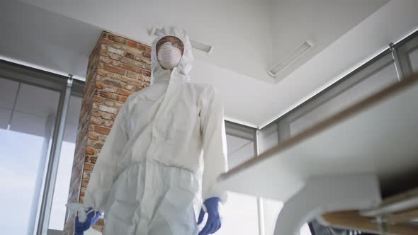 Bottom view video of technician walking through the office. Shot with RED helium camera in 8K.