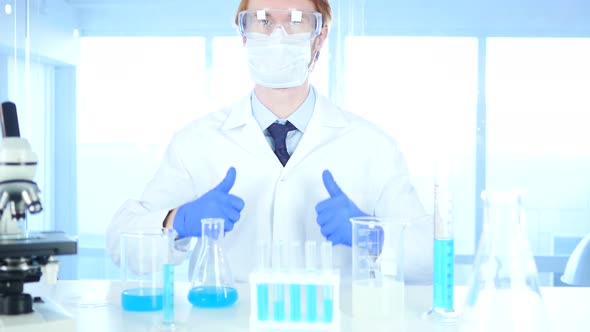 Thumbs Up by Scientist in Laboratory alt