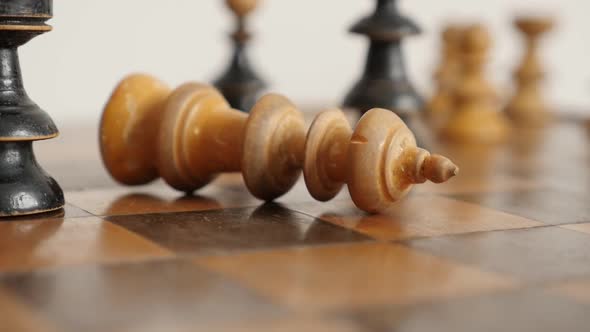 Shallow DOF old wooden chess set figures end game slow-mo 1920X1080 HD footage - White player king f alt