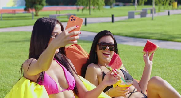 Happy Women in Swimsuits Taking Selfie on Cell Phone