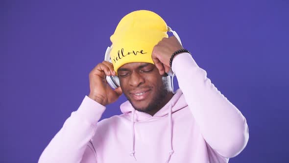 Studio Portrait of Young Man in Headphones