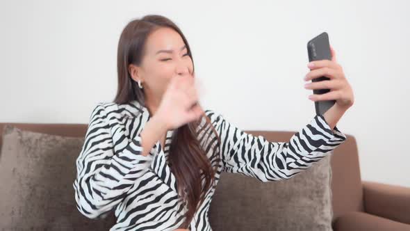 Young asian woman use smart phone