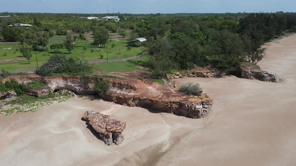 Moving aerial drone shot of Cliffs At Casuarina Beach in Darwin, Northern Territory