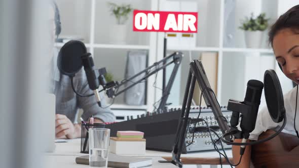 Pop Singer Singing in Broadcast Studio