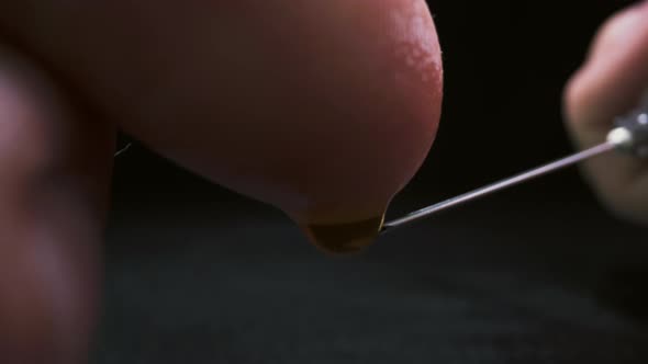 Researcher Touches Needle with Antiviral Vaccine By Finger