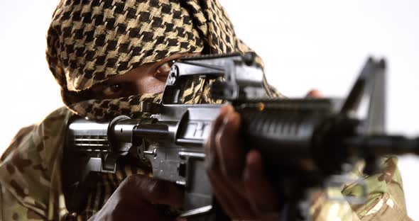 Terrorist aiming with machine gun alt