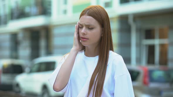 Teenage Girl Massaging Temples, Feeling Headache, Life in Noisy City, Migraine