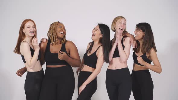 Young Attractive Women Mixed Race Group of Models Posing Laughing