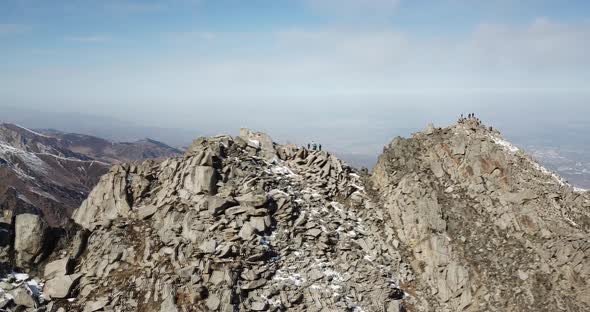 Top View of a Group of Tourists on a Peak