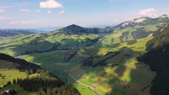 Flying From the Ebenalp Mountain Over a Valley in Switzerland