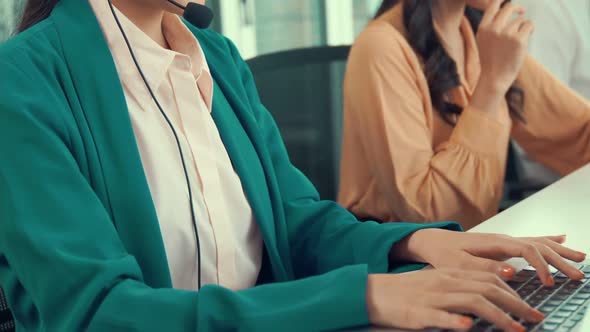 Businesswoman Wearing Headset Working Actively in Office