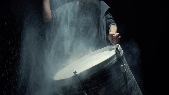 Slow Motion Dummer. Game on a Dusty Drum Close Up