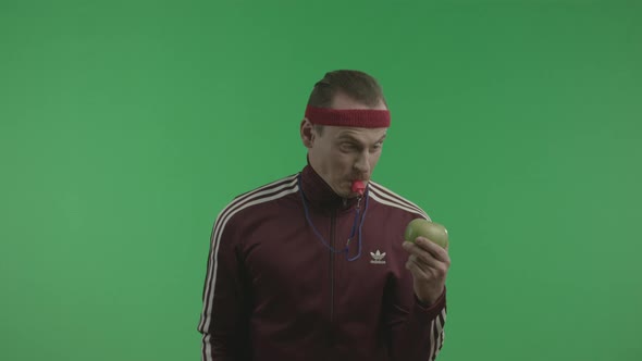 Athletic Man Is Smashing Apple By Whistle.