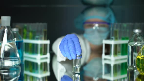 Scientist Holding Bottle With Transparent Injection Liquid, Antibiotic Studies