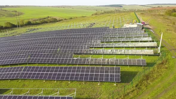 Aerial View of Solar Power Plant Under Construction on Green Field