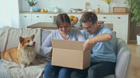 The Family Satisfied By a Quick Delivery. Unpacking of Order From Online Shops.