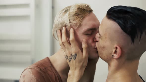 Gay Couple Hugging Each Other Kissing on the Lips Close Up