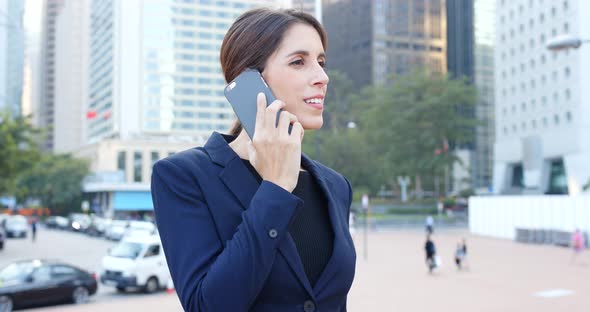 Businesswoman talk to cellphone at outdoor
