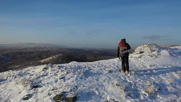 View From the Drone  Lone Hiker Walks Along the Top of a Mountain Range