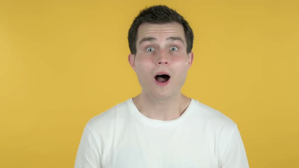 Wow, Happy Amazed Man Surprised By Gift, Yellow Background