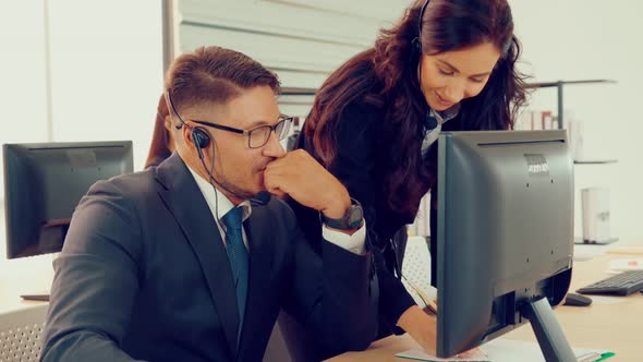 Business People Wearing Headset Working in Office