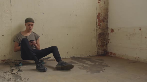 Fashionable young man in an abandoned warehouse