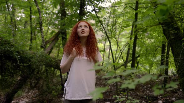 Girl Looking Around in the Forest