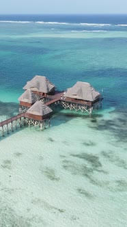 Tanzania  Vertical Video House on Stilts in the Ocean on the Coast of Zanzibar Slow Motion