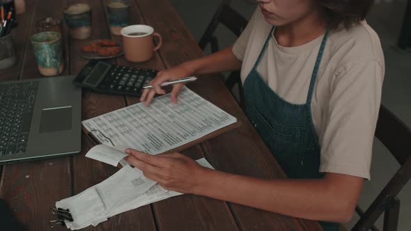 Workshop Manager Doing Bookkeeping