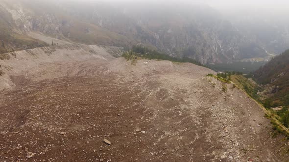 Aerial View of Belvedere Glacier Deep and Old Crevasses Ice in Belvedere Valley Around Mountains