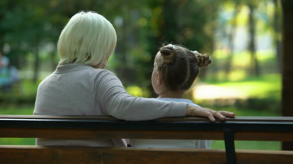 Grandmother Giving Advice to Granddaughter, Sharing Life Experience, Gossiping