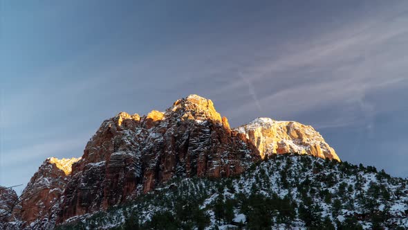 Time lapse of snow covered mountain top in Zion at sunset