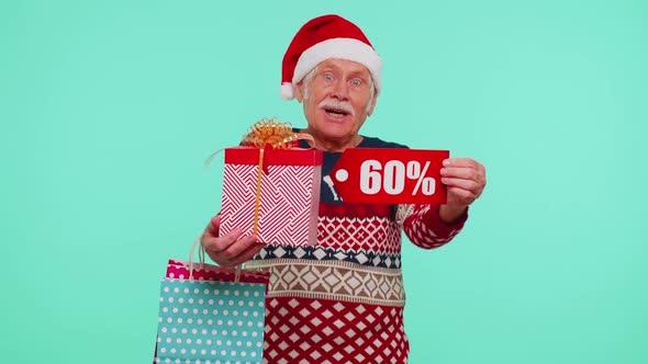 Grandfather in Christmas Sweater Showing Gift Box and 60 Percent Discount Inscriptions Banner Text