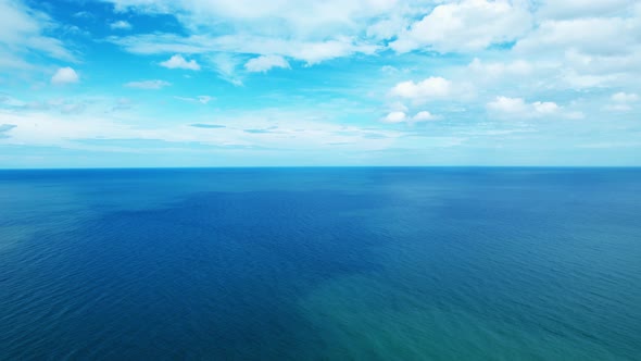 4K Aerial view of drone move on beautiful sea. Flight over ocean, open sea. Dynamic aerial shot.