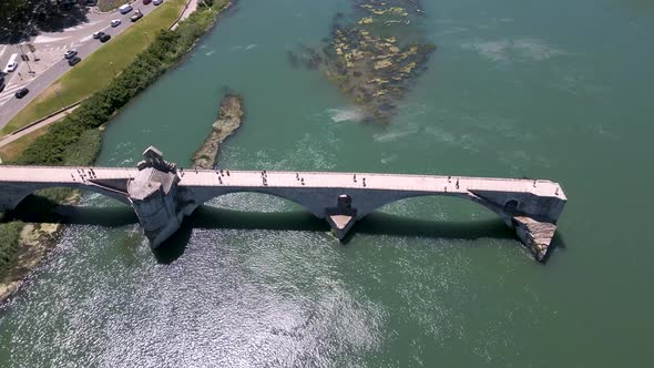 Flight over Avignon Bridge on Rhone river in France