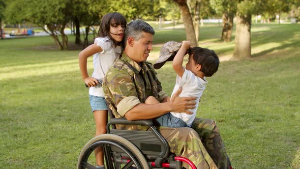 Disabled Military Dad Playing with Kids in Park