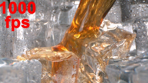 Brandy Whisky Splashing On Ice In A Glass In Slow Motion