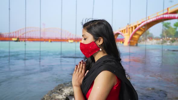 Indian Woman Meditating Wearing Coronavirus Protection Face Mask Sitting in Sadhana or Spiritual