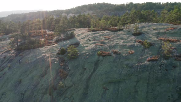 Drone Flight At Sunrise Over Climber On Mountain Slope