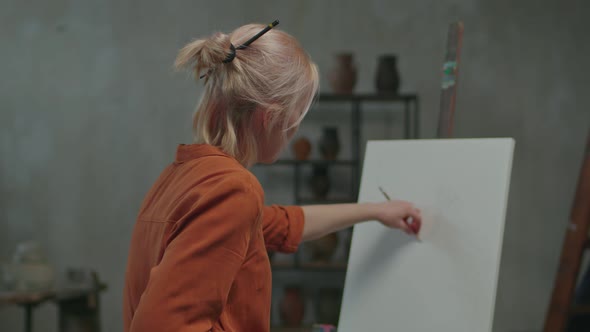 Charismatic Female Artist Creating Design of Painting