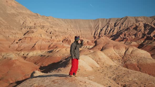 An Asianlooking Guy Walks and Looks at the Beauty of the Area