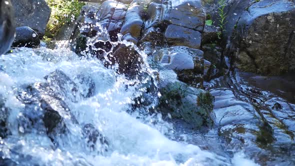 Small Rapids With Fast Moving Water Running Beside Rocks 2