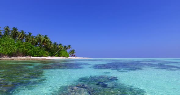 Wide birds eye abstract view of a sunshine white sandy paradise beach and aqua blue ocean background