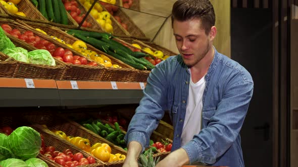 Guy Buys Fruits and Vegetables at the Hypermarket